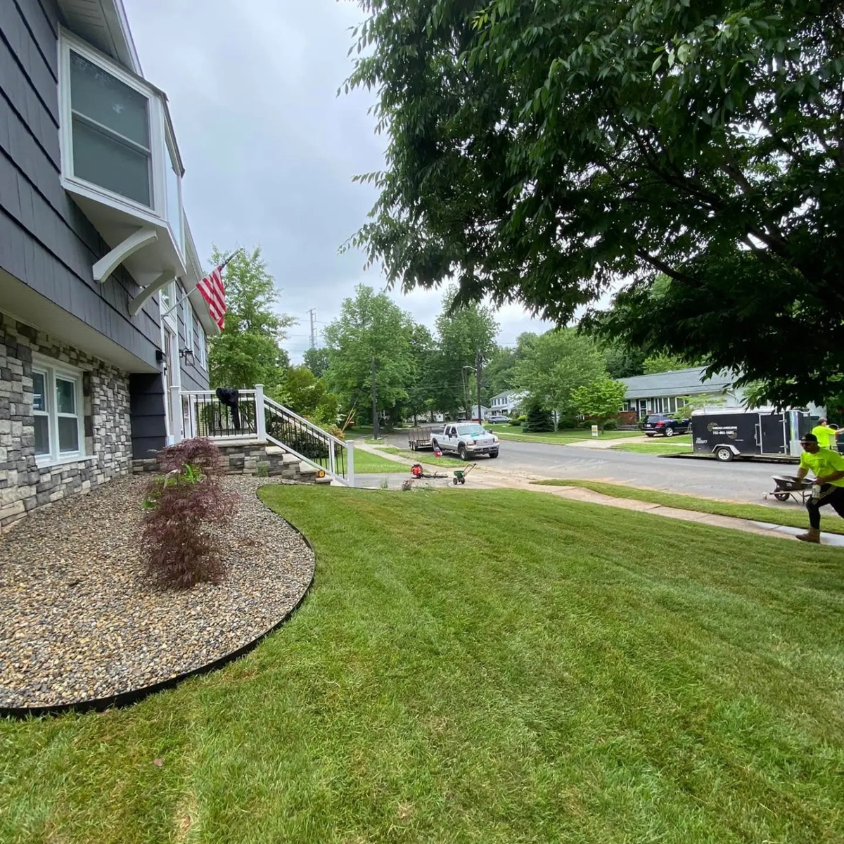 Same front yard after Fiorenza Landscaping installed a new lawn and stone beds
